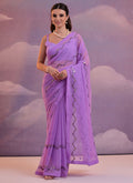 A beautiful lavender georgette saree featuring intricate sequence embroidery work