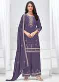 A violet Vichitra silk palazzo suit featuring intricate gota patti and embroidery for a festive wedding look.