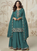 Turquoise Simar Silk palazzo suit with intricate embroidery and gota patti detailing.