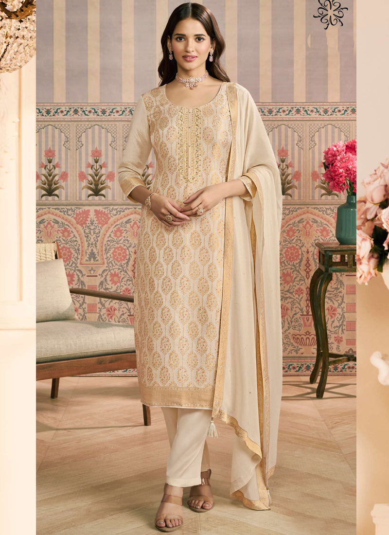 Off-white jacquard silk designer salwar suit featuring detailed hand embroidery