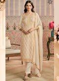 Off-white jacquard silk designer salwar suit featuring detailed hand embroidery