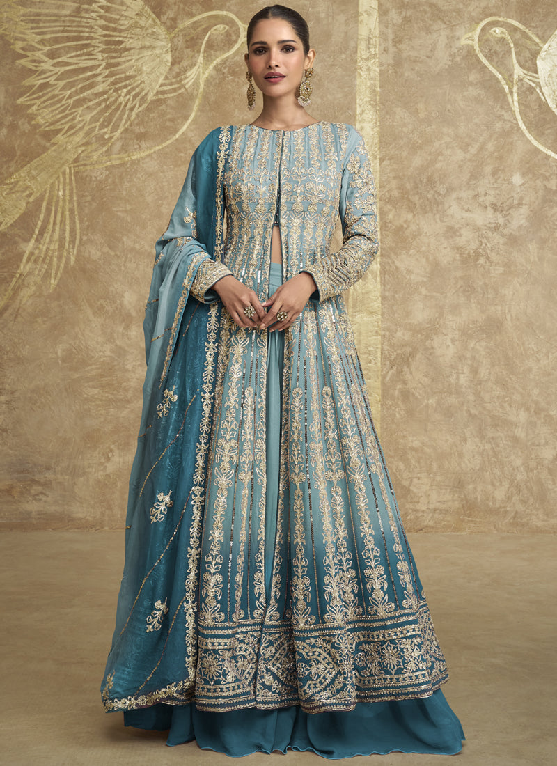 Sky blue lehenga style suit with intricate embroidery and gota patti detailing.