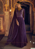Elegant violet and gold shimmer jacquard silk gown with intricate embroidery details.