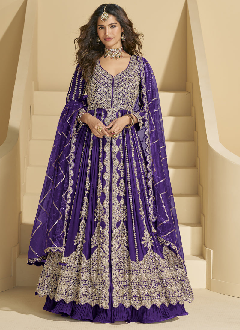 Violet and gold embroidered chinon silk lehenga style suit with traditional festive aesthetic.