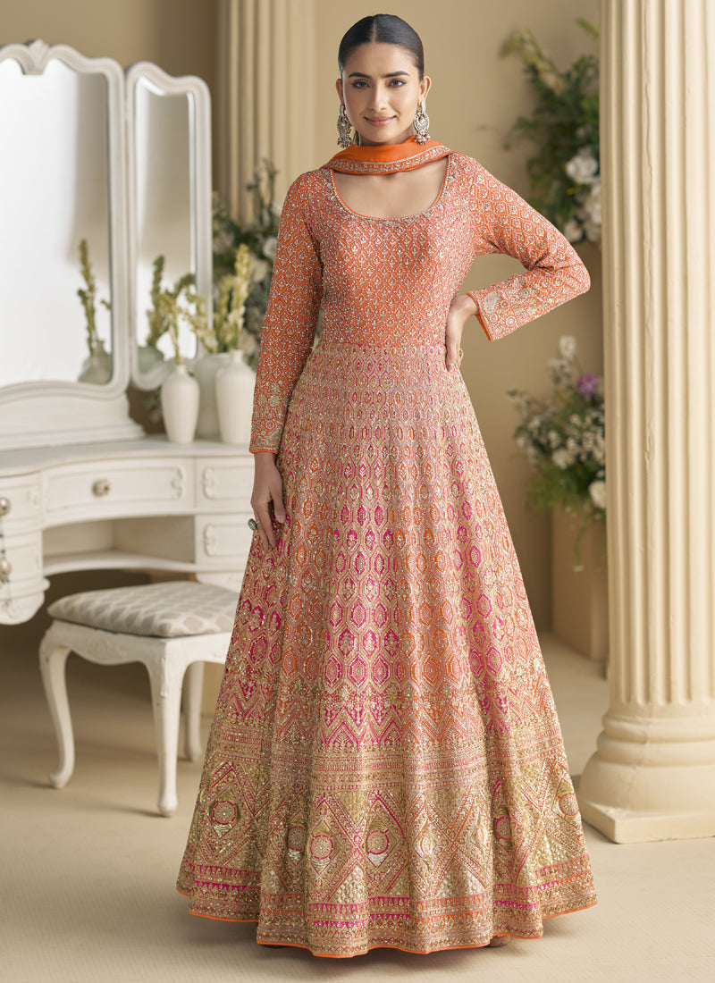 Orange gown with intricate Seroski and Zarkan embroidery and matching dupatta