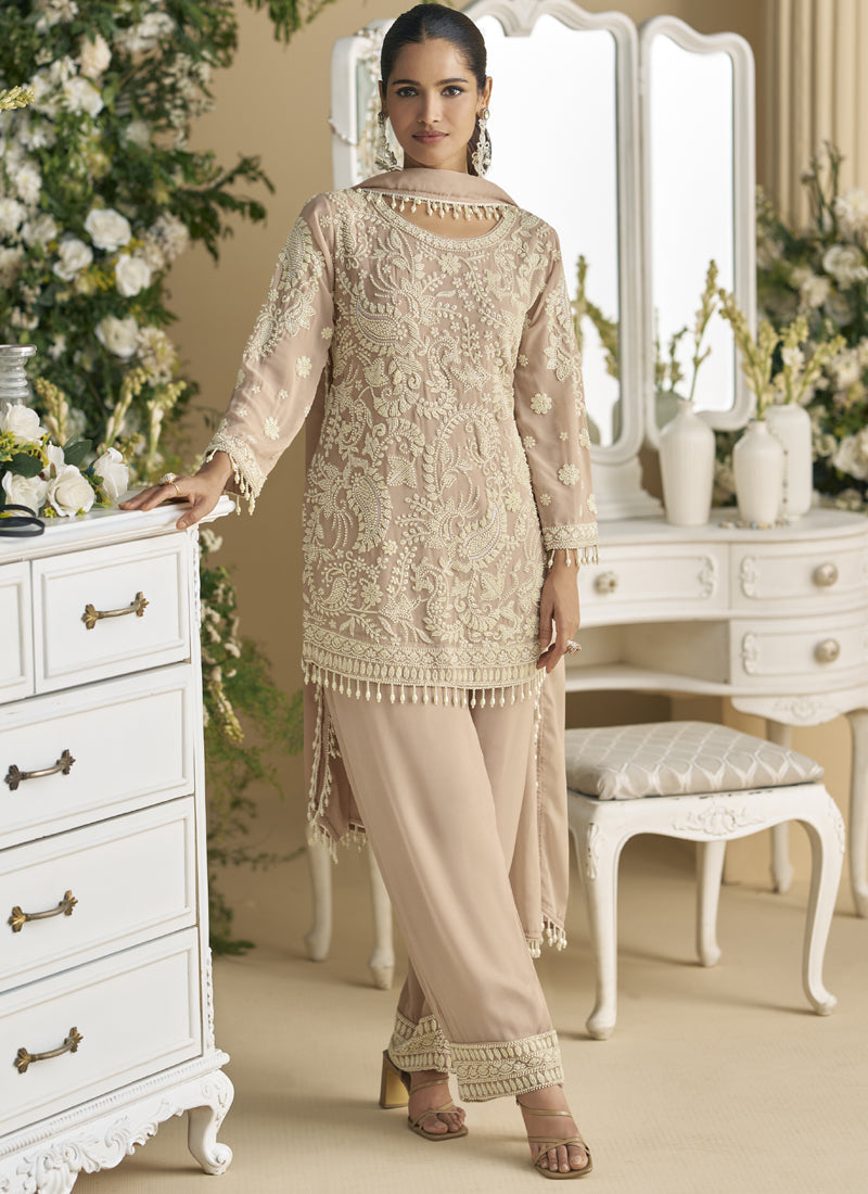 Beige Georgette and Net salwar suit adorned with embroidered bead work