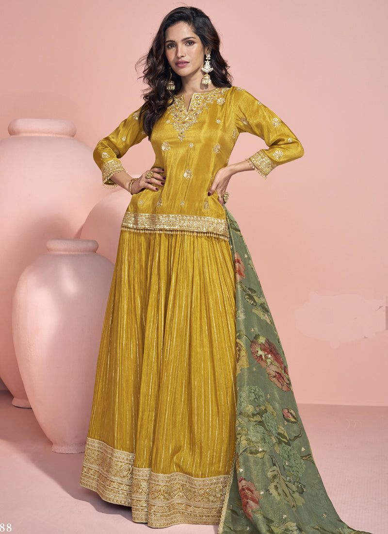Yellow jacquard silk lehenga style suit with intricate embroidery and gota patti details