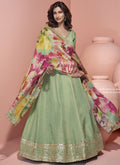 Pista green viscose jacquard silk Anarkali suit with intricate embroidery and gota patti detail.