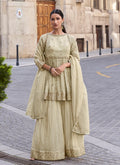 Sophisticated off-white silk palazzo suit with detailed resham and gota patti embroidery.
