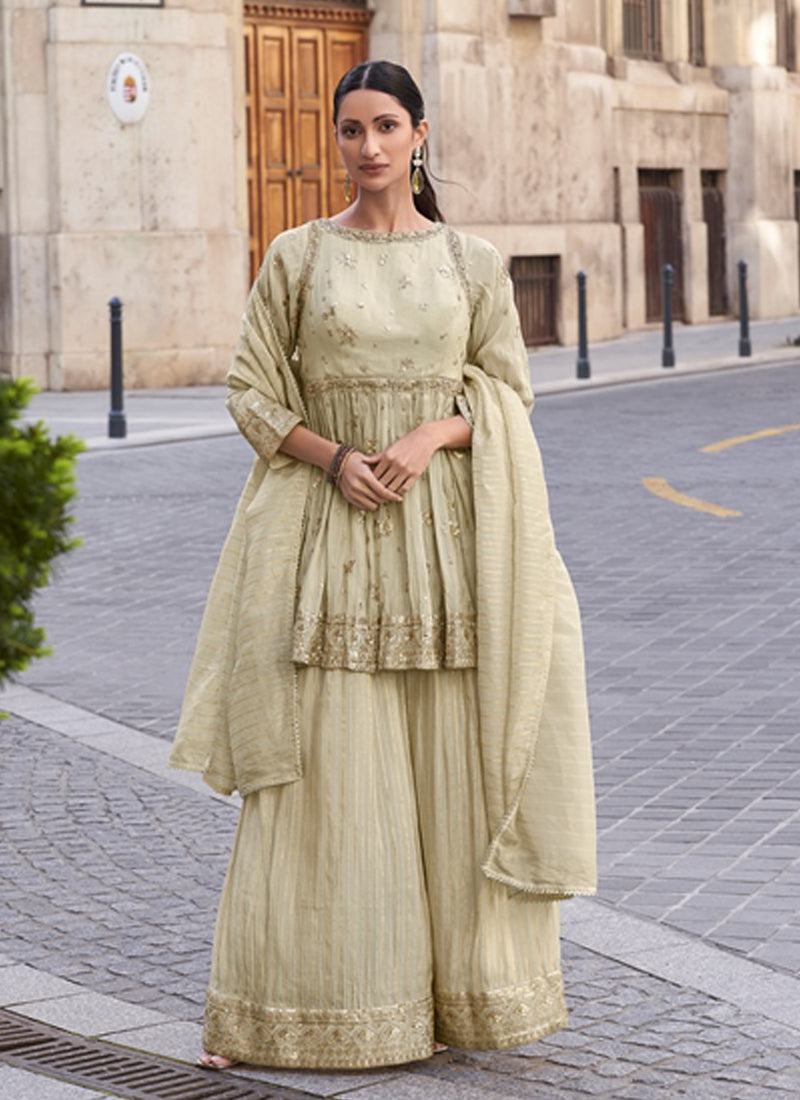 Sophisticated off-white silk palazzo suit with detailed resham and gota patti embroidery.