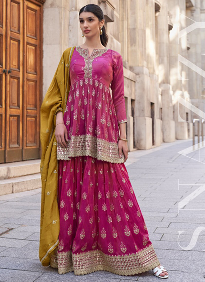 Elegant pink silk palazzo suit with intricate gota patti and resham embroidery.