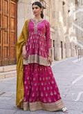 Elegant pink silk palazzo suit with intricate gota patti and resham embroidery.