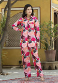 A fashionable multi-color muslin co-ord set with pink, white, brown, and orange patterns