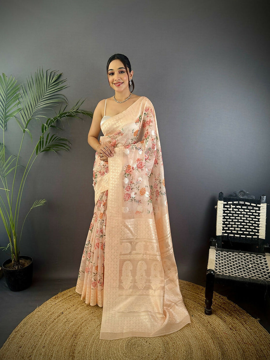 Beige Banarasi silk saree featuring intricate floral motifs with unstitched blouse fabric