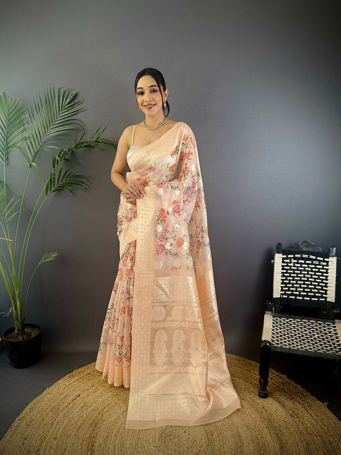 Beige Banarasi silk saree featuring intricate floral motifs with unstitched blouse fabric