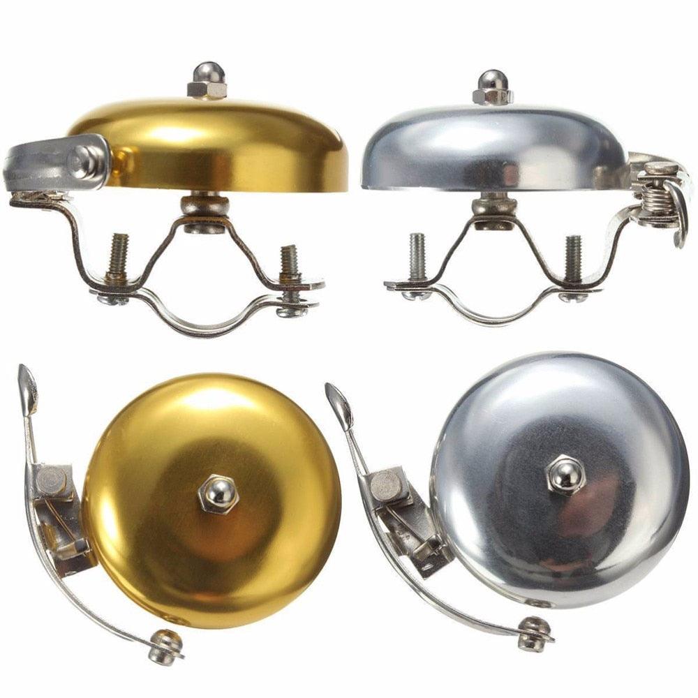 Stevvex Vintage Classic Bicycle Bell in gold and silver finish mounted on a handlebar