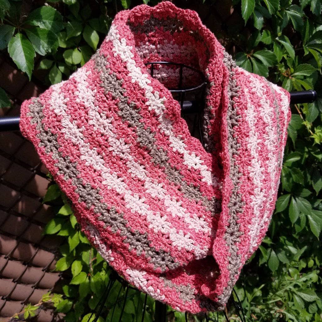 Vintage Rose infinity scarf featuring a delicate crochet knit pattern, displayed in a soft, natural light.