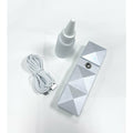 VIP Diamond Cut Nanomister in metallic silver and white, a portable skincare device for facial hydration.