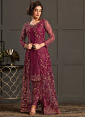 A beautiful wine colored heavy net Pakistani suit with detailed embroidery and matching dupatta.