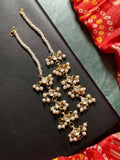 White Pachi Kundan earrings with beaded chain detail on brass