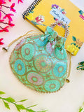 Mint green and gold geometric print bohemian potli bag for women