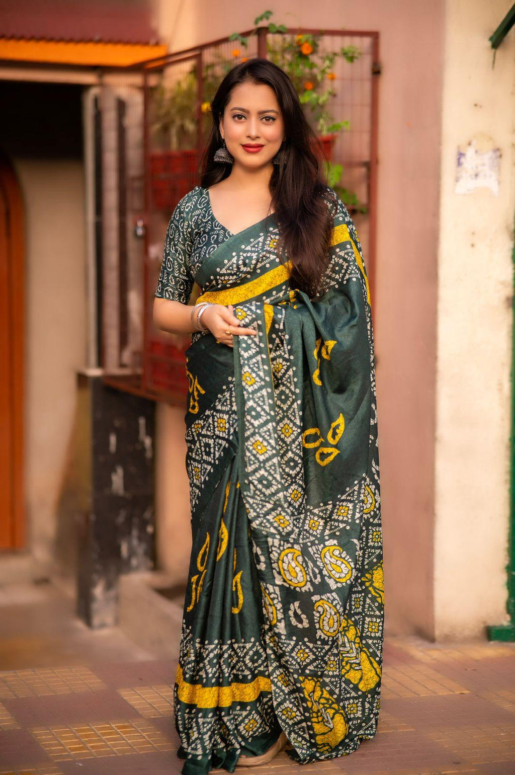 Green silk blend saree with batik print and matching blouse