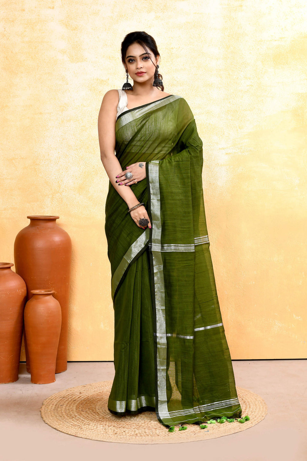 Moss green cotton blend handloom saree with ornate embellished zari border