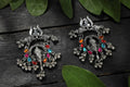 Traditional Ganesha design earrings with multi-colored Kundan stones and silver finish