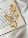 Golden leaf and pearl drop earrings with Monalisa stone detailing