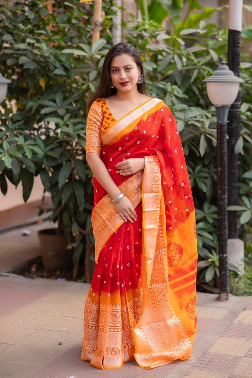 Red jute silk ethnic saree with bandhani print and cut broaso border
