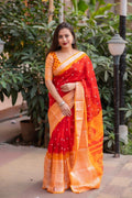 Red jute silk ethnic saree with bandhani print and cut broaso border