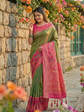 A beautiful Mehndi-colored Pochampally Silk saree with intricate patterns and a matching blouse piece.