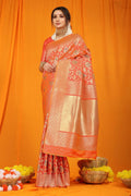 Vibrant Orange Kanjivaram Silk saree with traditional Zari woven detailing.