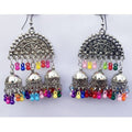 Half moon design triple jhumka earrings with multi-color pearls and silver oxidized metal.