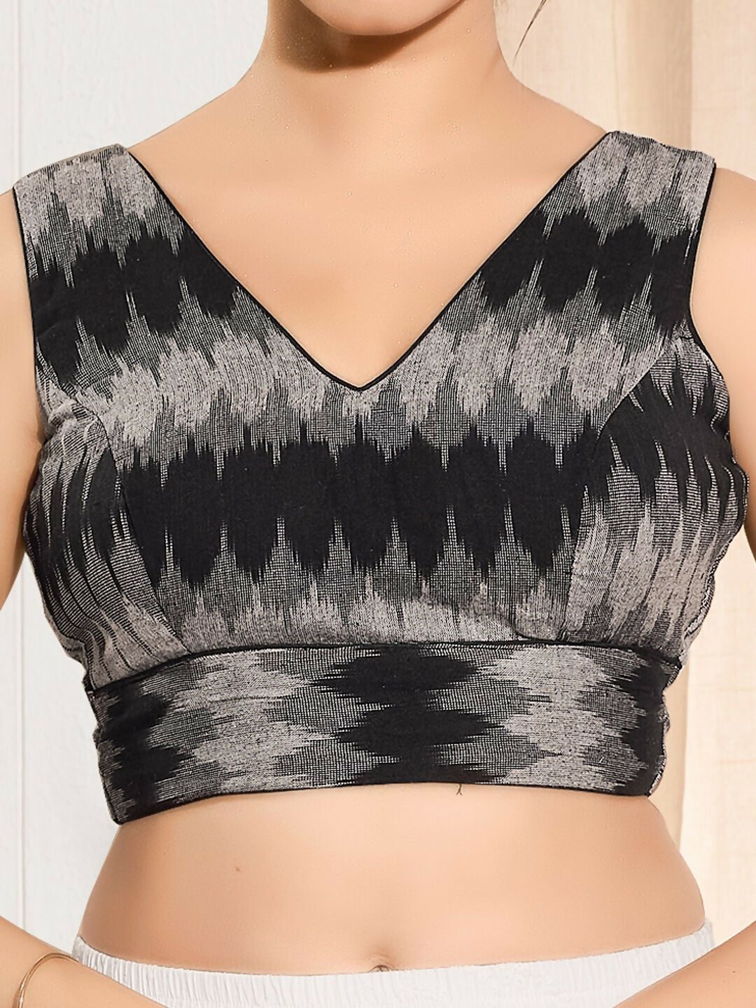 Black Ikat print silk sleeveless padded blouse with V-neck