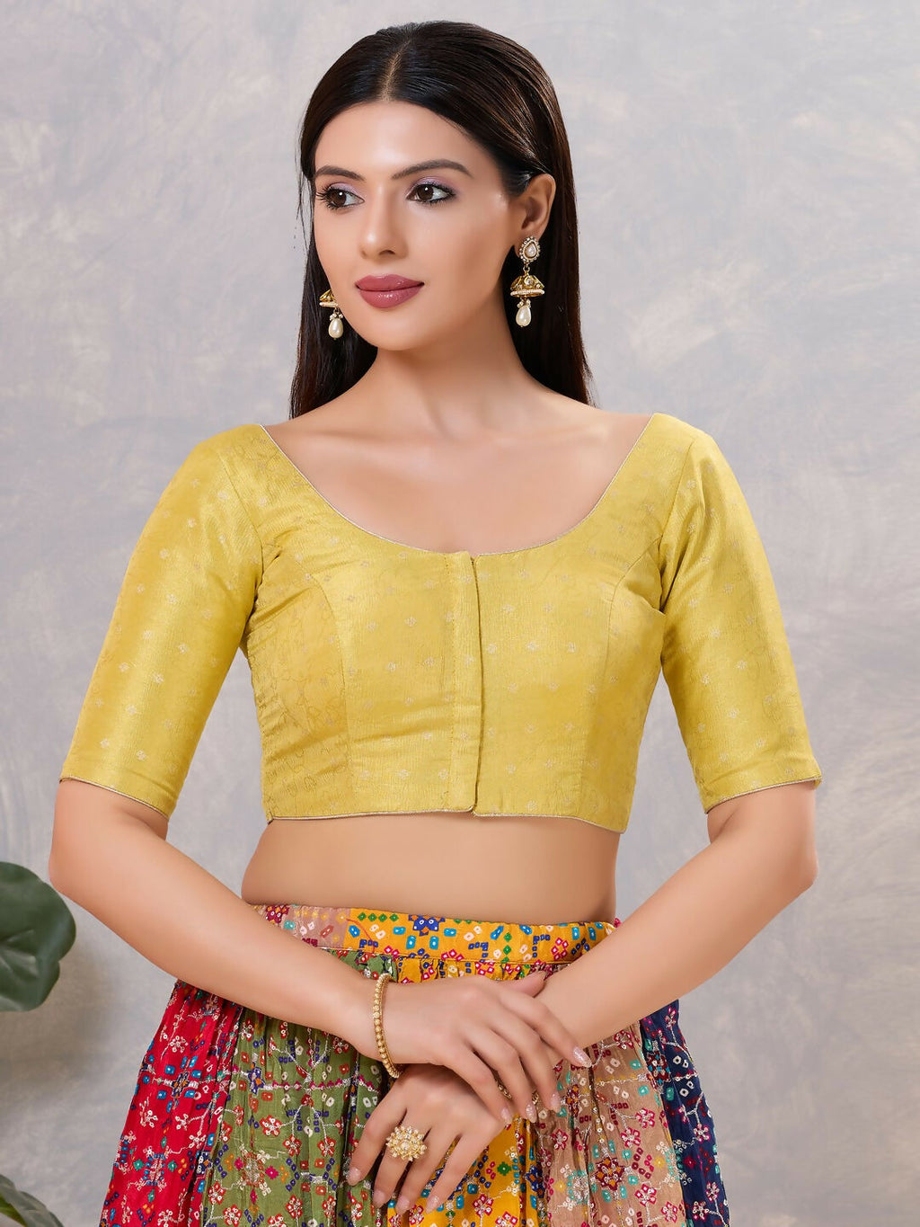 Vibrant yellow silk round neck stitched blouse, ideal for ethnic occasions