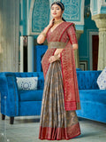 Elegant grey linen cotton saree with a contrasting red blouse, draped for a formal look.