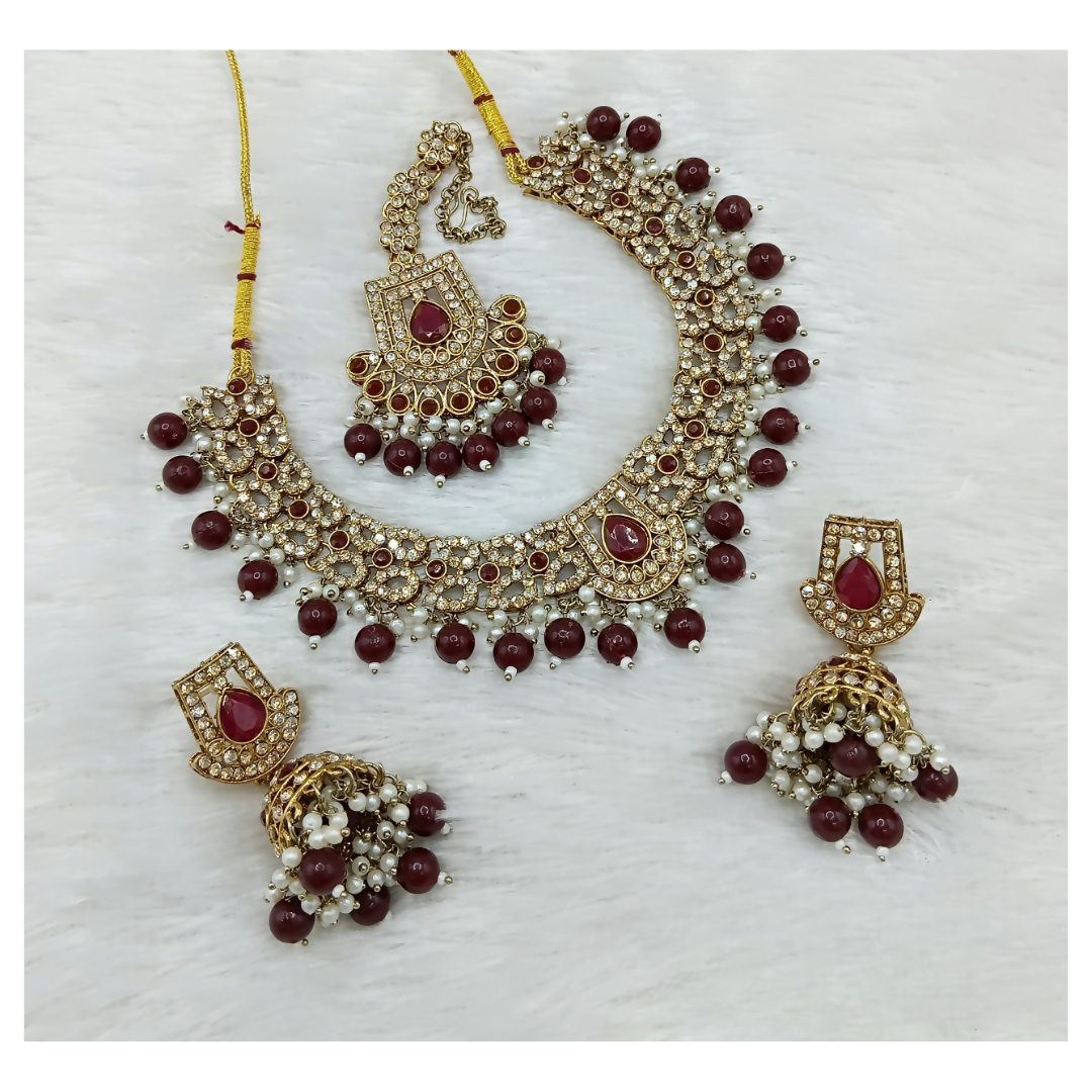 Royal maroon stone work necklace set with matching earrings for a classic traditional look