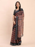 Classic black linen cotton saree with a matching black blouse piece.