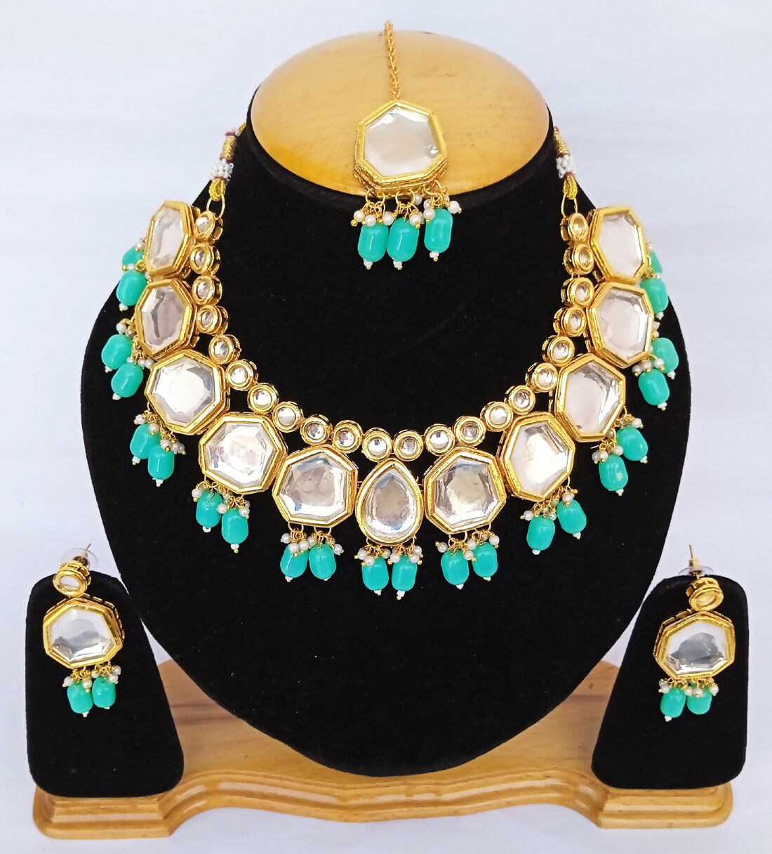 Elegantly styled Blue Kundan necklace with intricate gold-plated detailing and adjustable cord.