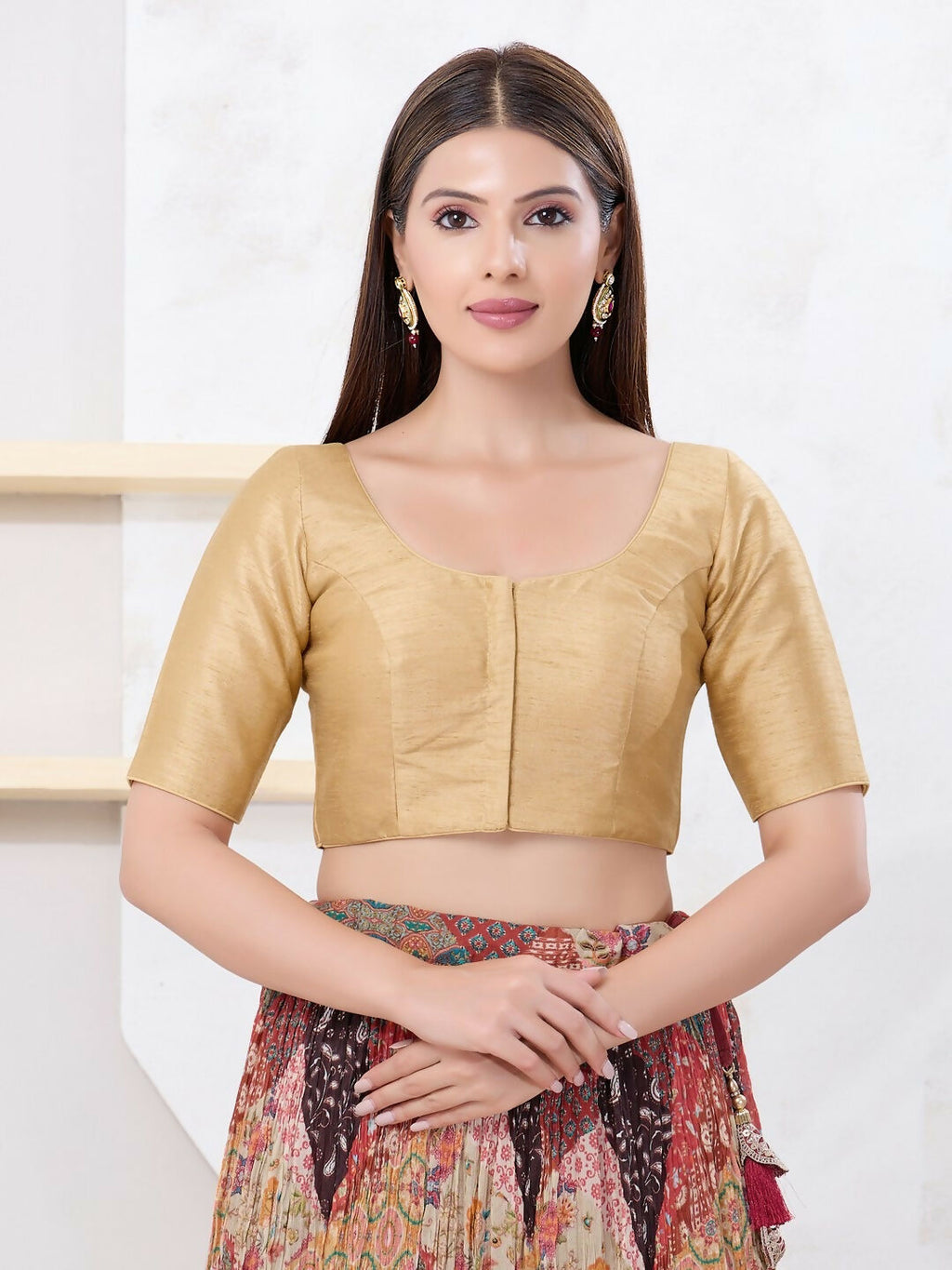 Gold Dupion silk sleeveless blouse with front open design and round neck