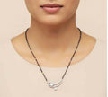Elegant white moonstone mangalsutra made of brass, suitable for traditional and festive wear.