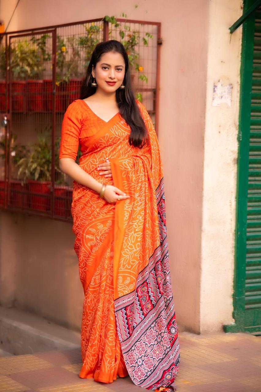 Orange silk blend Ajrak saree with traditional bhandi prints and unstitched blouse