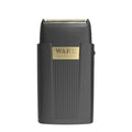 Close up of a matte black and gold Micro Power shaver for men on a clean bathroom counter.