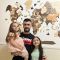 Decorative 3D wooden world map wall art for kitchen interior featuring engraved details and country borders.