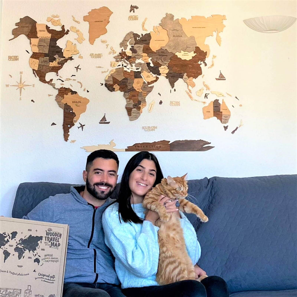 Inspirational travel-themed wall art displayed in a cozy, stylish living room setting.