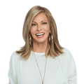 Woman wearing a shoulder-length Watch Me Wow wig with textured bangs and multi-tonal brown to blonde highlights.