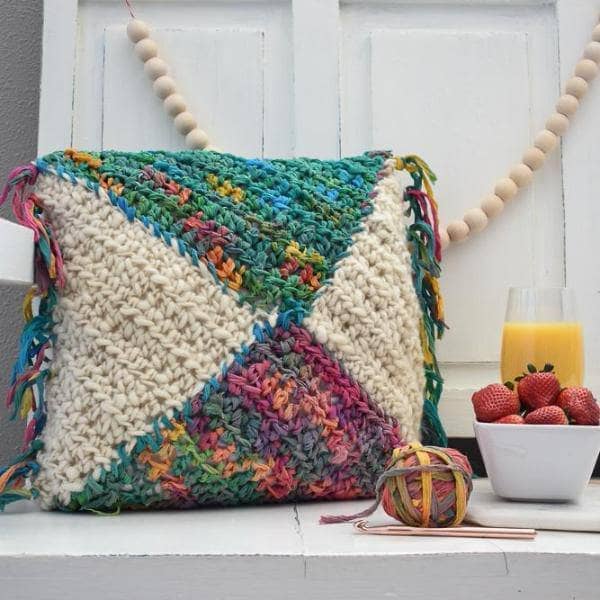 Decorative Watercolor Pillow with fringe detail and mixed fiber textures