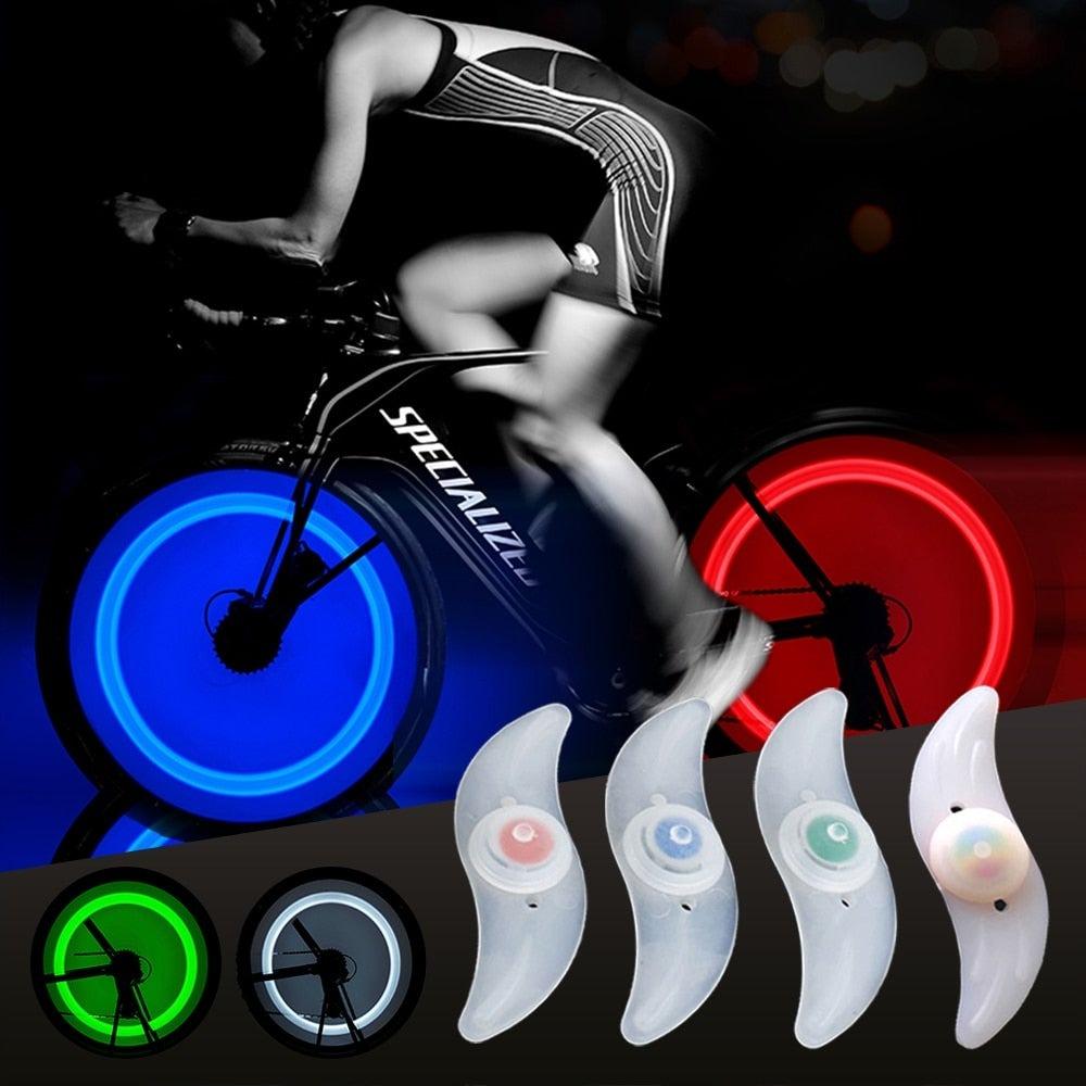 Colorful waterproof LED bike wheel spoke light with 3 lighting modes attached to a bicycle wheel