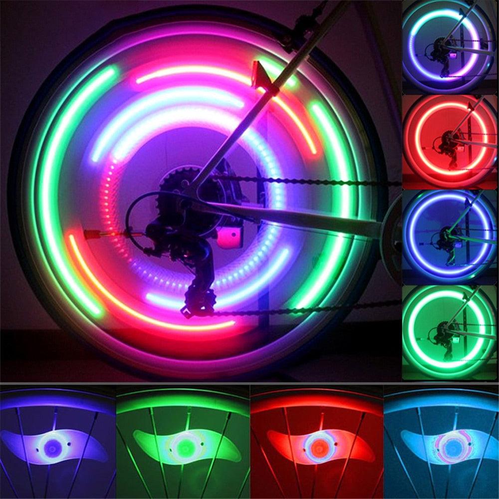 Willow shape LED bicycle spoke light mounted on a bike wheel for enhanced night safety.